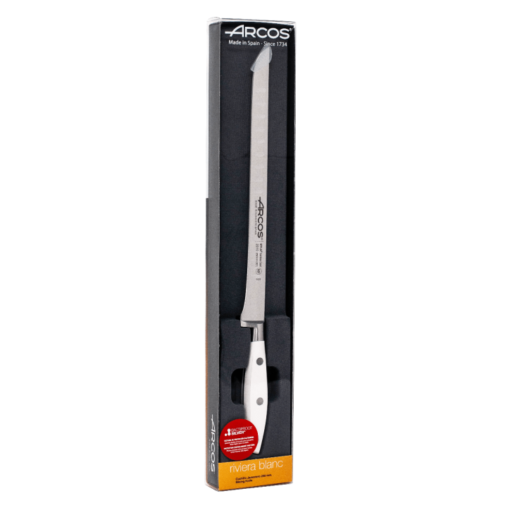 ARCOS SERIE RIVIERA BLANCO: CUCHILLO JAMONERO ALVEOLADO 250mm. FORJADO Ref.231024